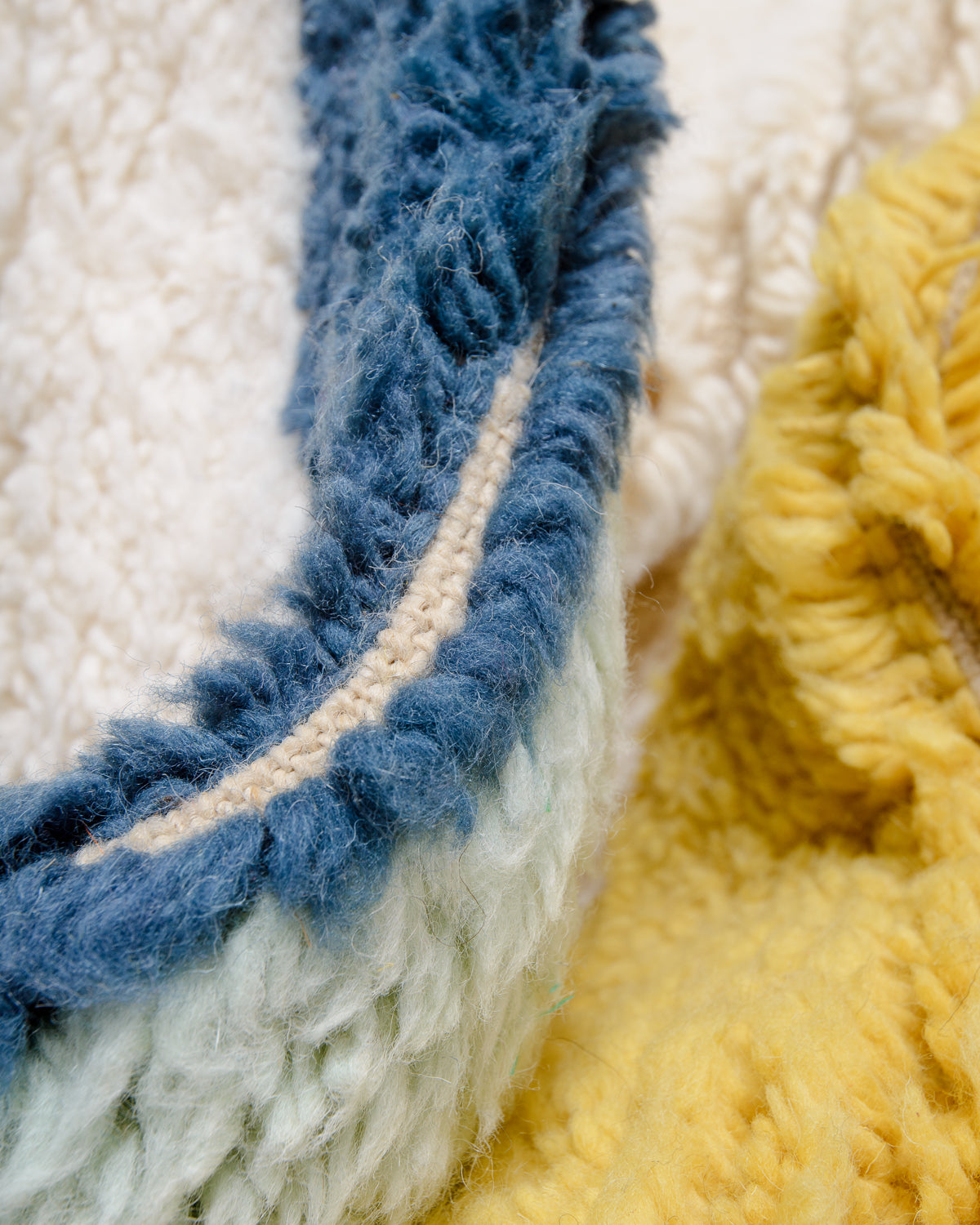 Modern, designer, handcrafted Berber rug from Morocco. Beniourain carpet with beautiful colours and patterns and fluffy wool texture.